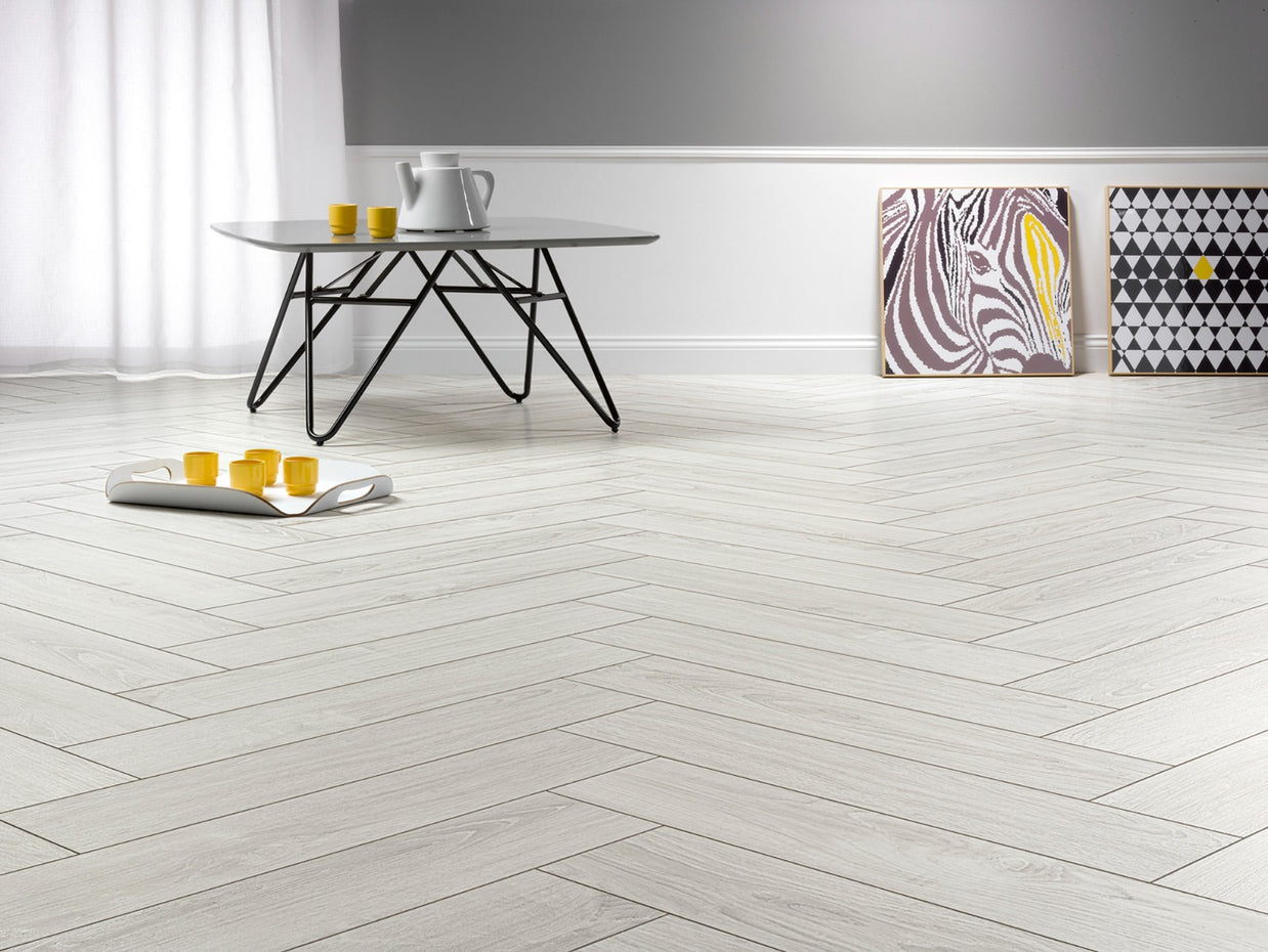 Polar Oak Herringbone Laminate 12mm, matt laminate flooring for living rooms, bedrooms and hallways at Irwin Tiles