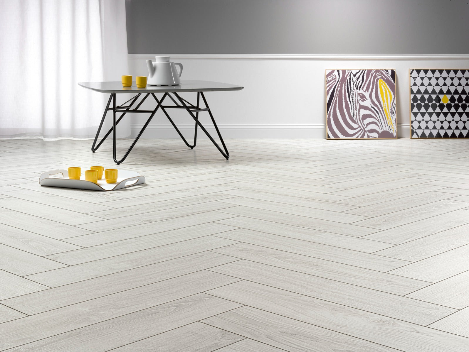 Polar Oak Herringbone Laminate 12mm, matt laminate flooring for living rooms, bedrooms and hallways at Irwin Tiles