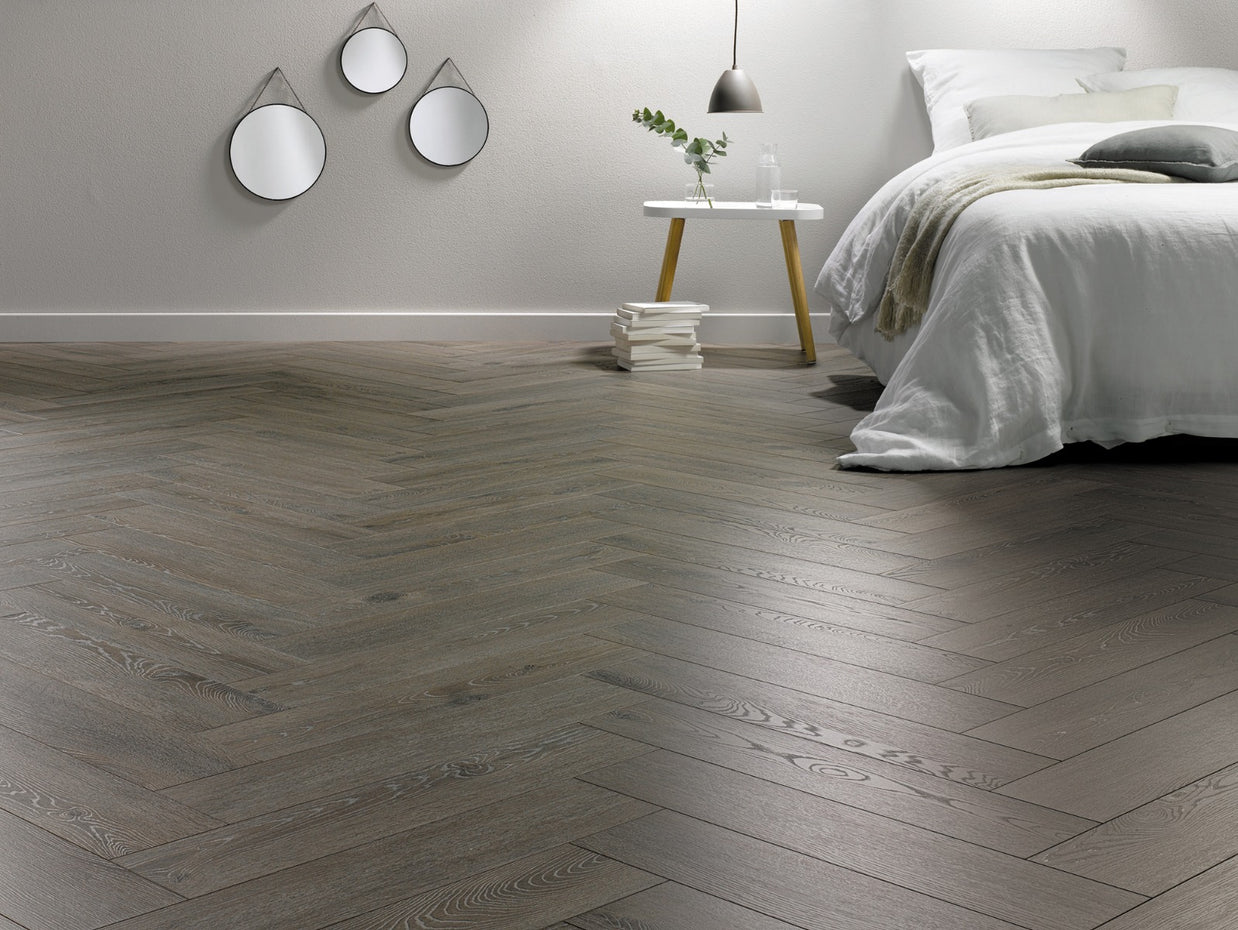 Aronia Oak Herringbone Laminate 12mm, laminate flooring for living rooms, bedrooms and hallways at Irwin Tiles