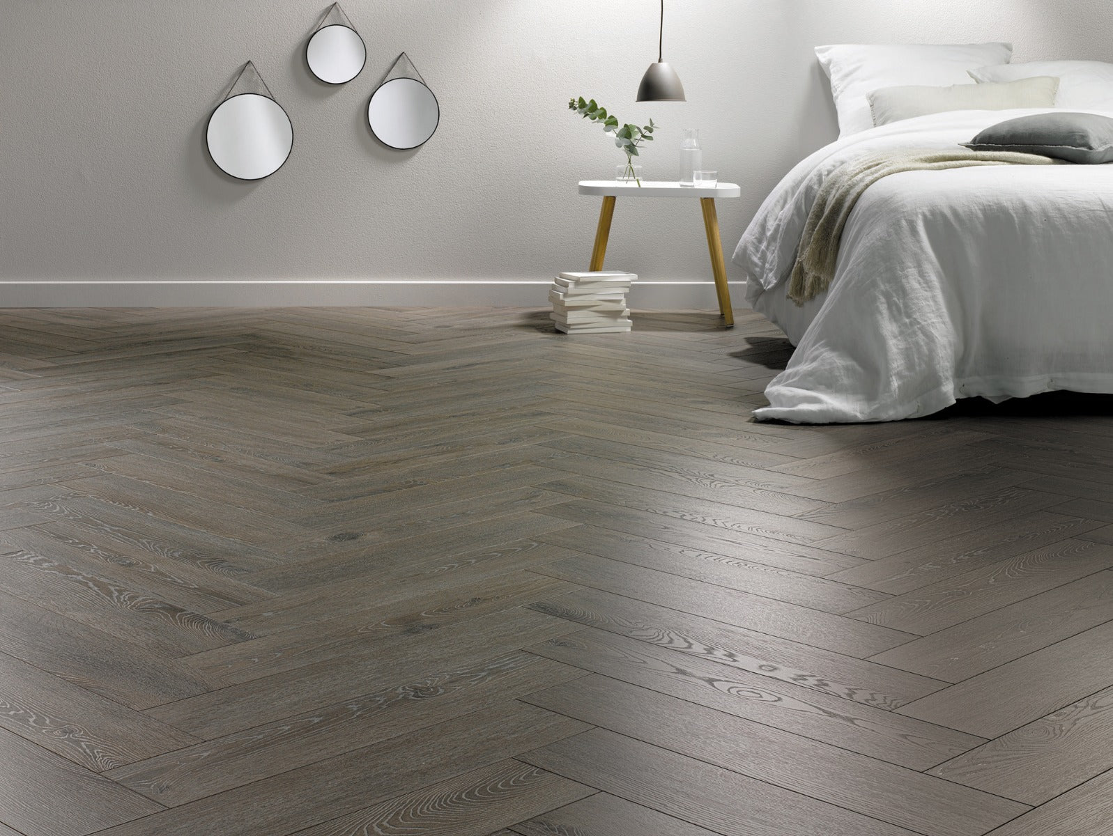 Aronia Oak Herringbone Laminate 12mm, laminate flooring for living rooms, bedrooms and hallways at Irwin Tiles