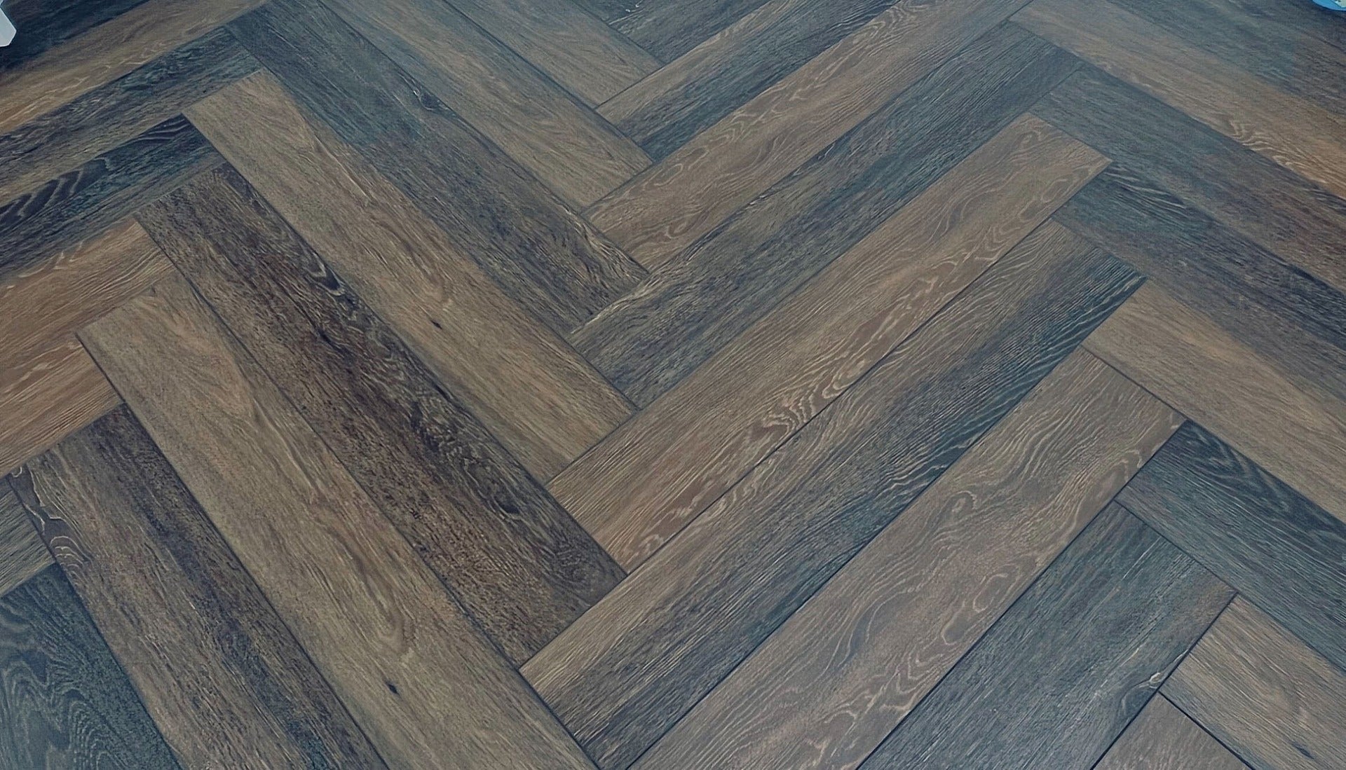 Dark Truffle Herringbone Laminate 12mm Waterproof, laminate flooring at Irwin Tiles