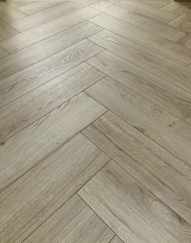 Le Harve Oak Herringbone Laminate 12mm All Over Water Resistant, laminate flooring for kitchens, hallways at Irwin Tiles