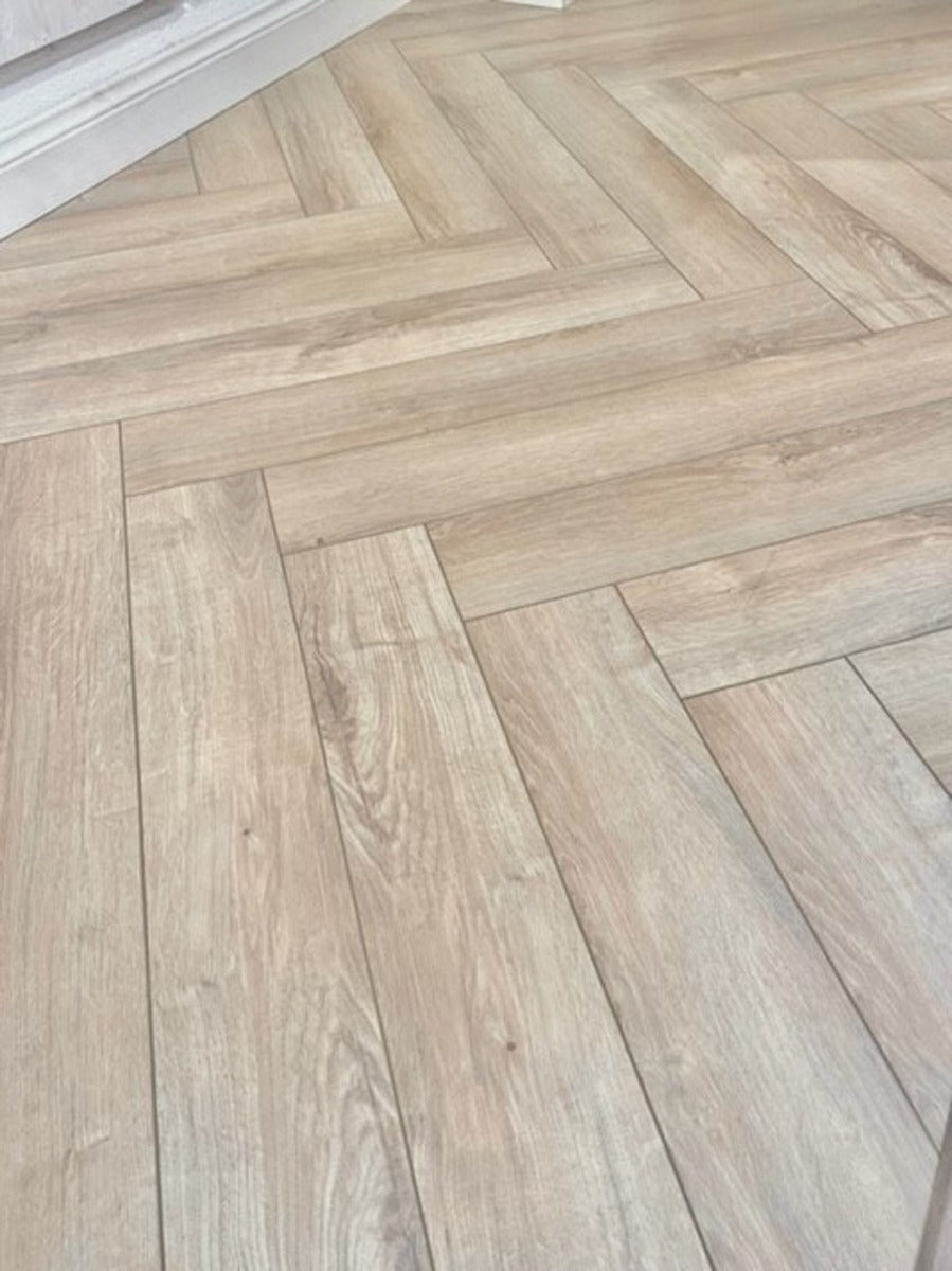 Natural Moss Herringbone Laminate 12mm Waterproof, laminate flooring for kitchens, hallways and living rooms at Irwin Tiles