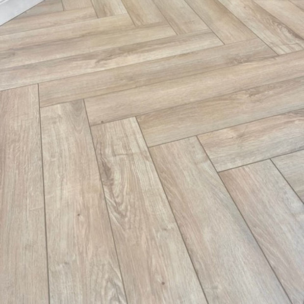 Natural Moss Herringbone Laminate 12mm Waterproof, laminate flooring for kitchens, hallways and living rooms at Irwin Tiles