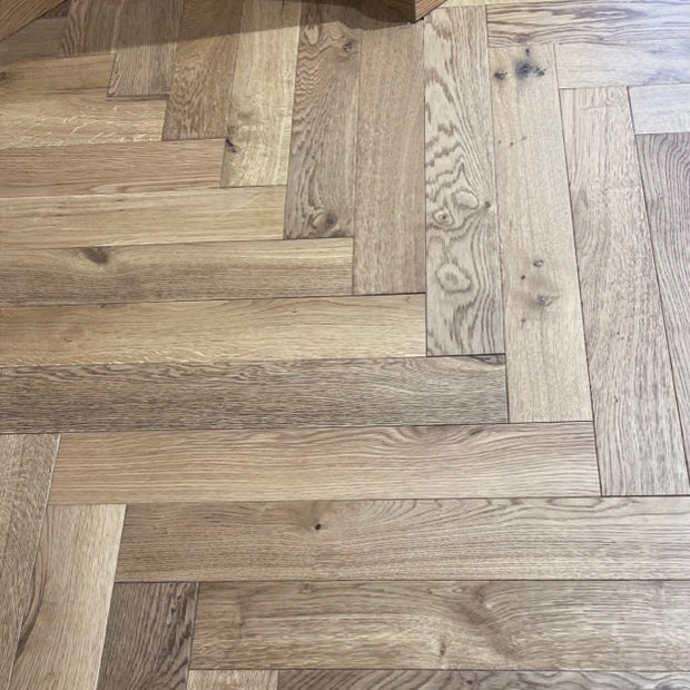Tudor Oak Engineered Herringbone, lacquered engineered wood flooring at Irwin Tiles